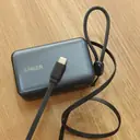 Anker A1638 power bank photographed on a desk showing the InstaCord flat cable and lanyard - CairoVolt stock unit