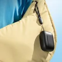 Soundcore A25i charging case clipped to a bag by its lanyard strap - علبة شحن سماعات أنكر - CairoVolt