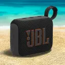 JBL Go 4 JBLGO4 black speaker on beach sand with sea in the background - CairoVolt