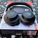 JBL Tune 770NC JBLT770NC black headphones unboxed on the open box with warranty card visible - CairoVolt